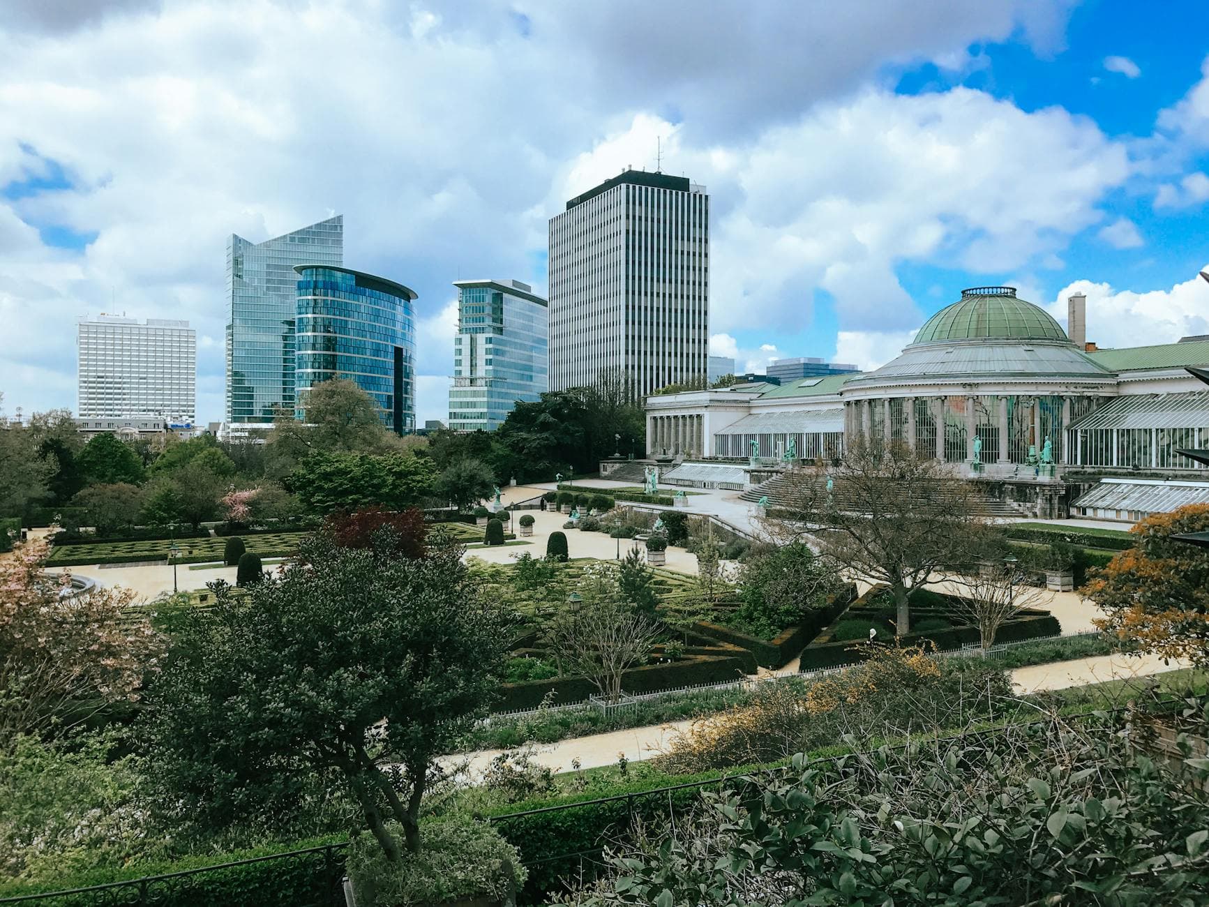 Skyline view of Le Botanique garden with modern buildings in Brussels, Belgium.