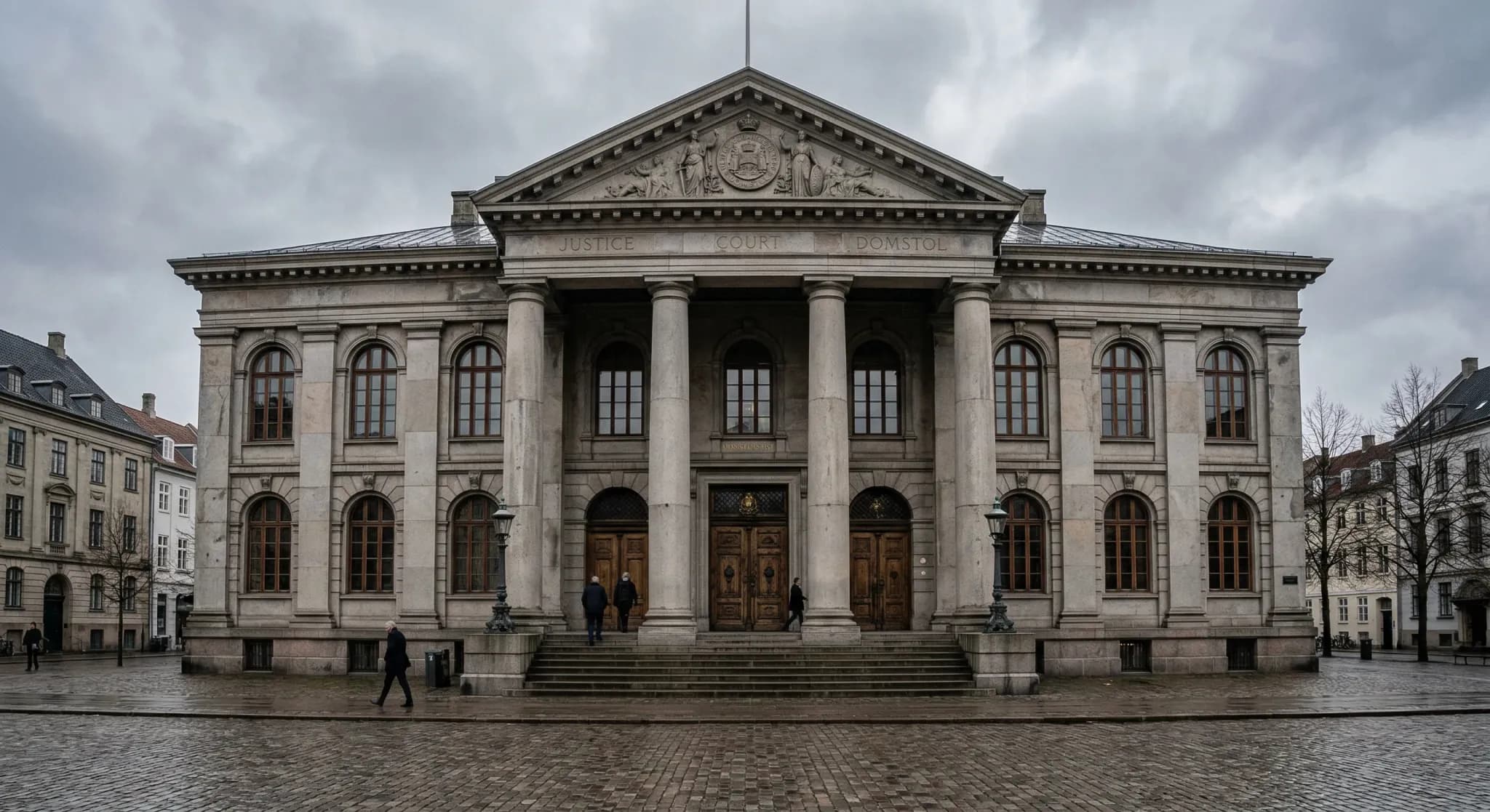 A photorealistic wide-angle shot of a neoclassical courthouse building with heavy stone columns and tall wooden doors under an overcast grey sky. The scene is quiet and formal, capturing the somber at