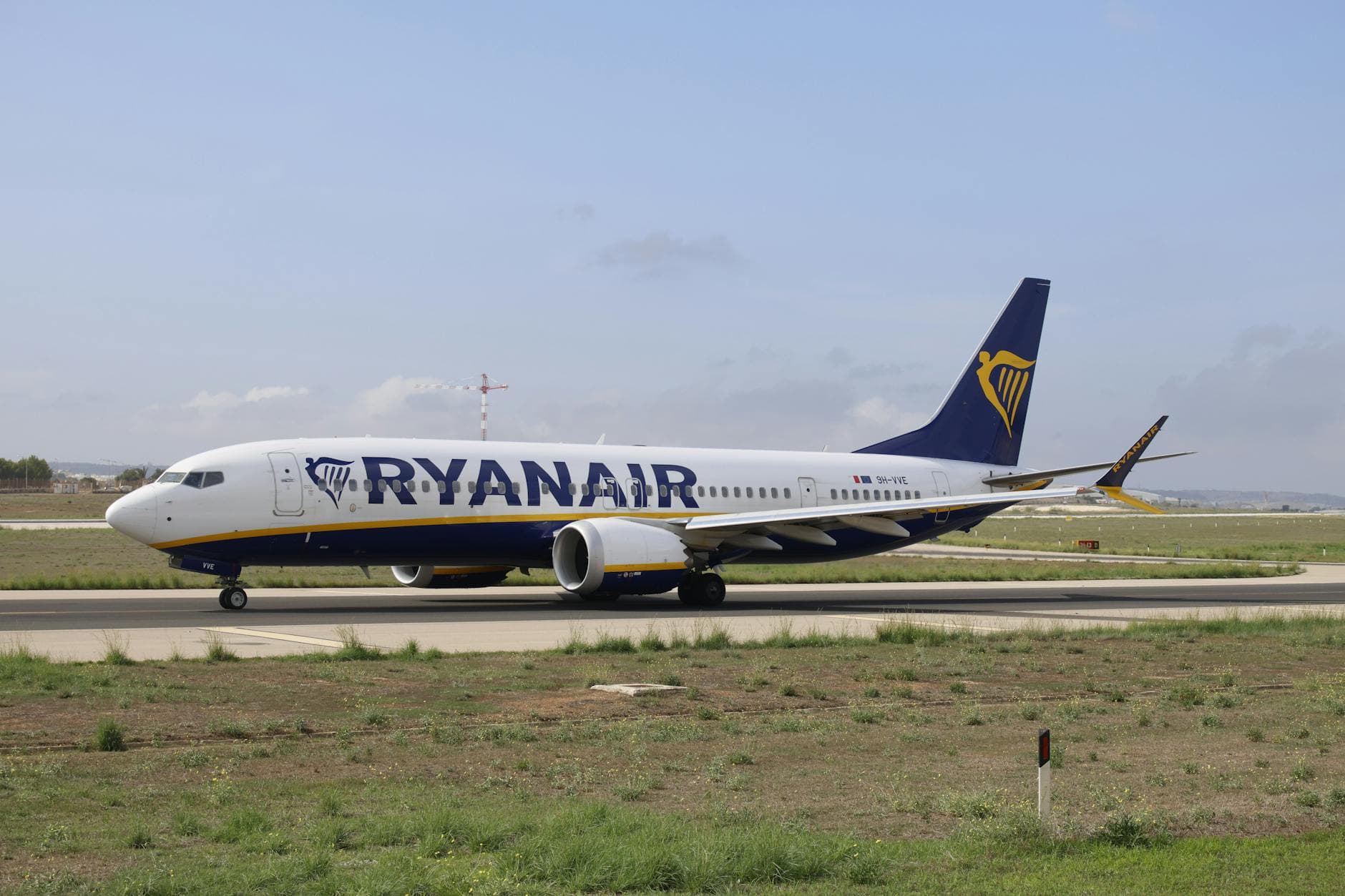 Ryanair Boeing 737 on runway, capturing a clear daytime airport scene.