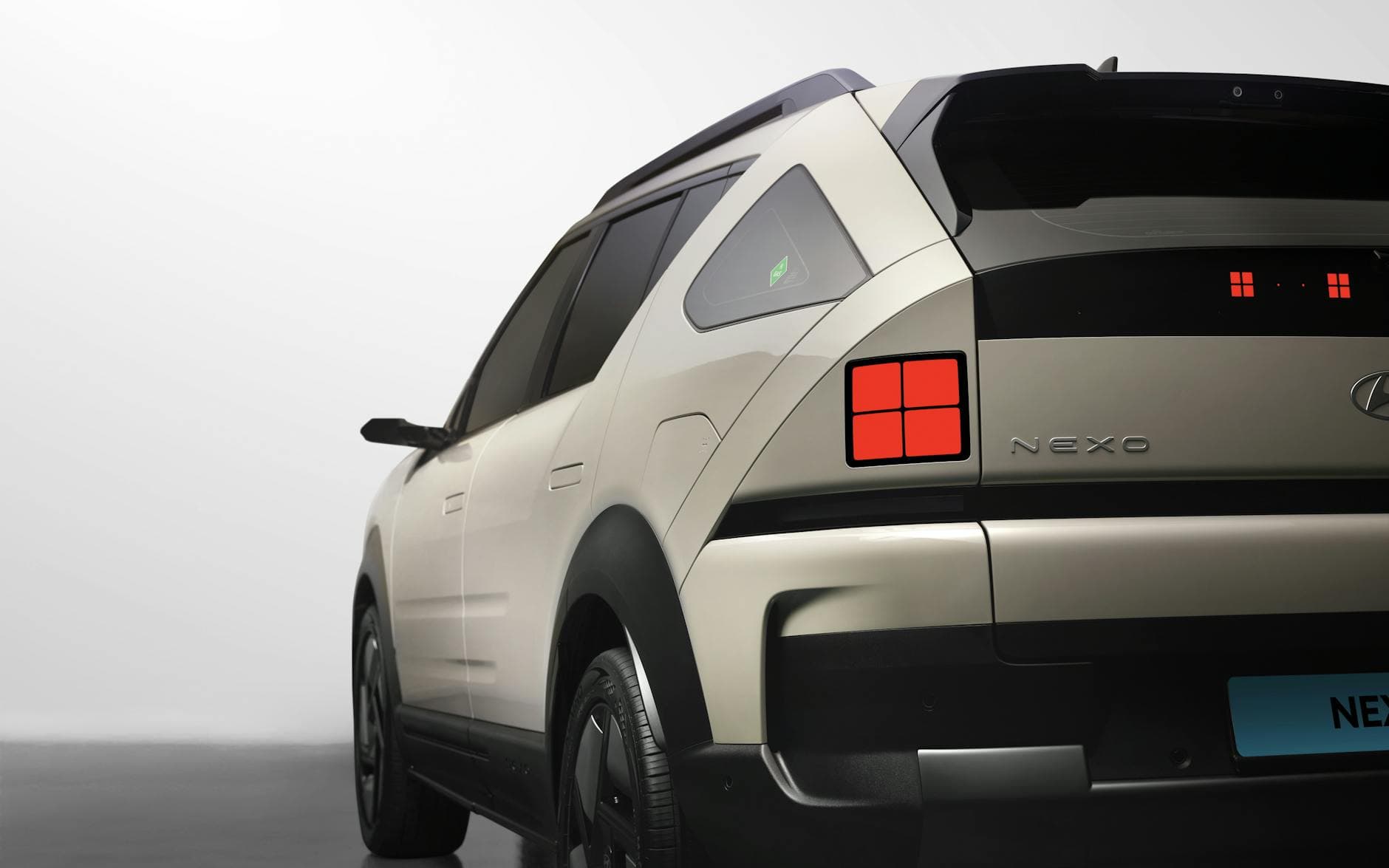 Detailed rear view of the Hyundai Nexo FCEV captured in a modern studio setting.