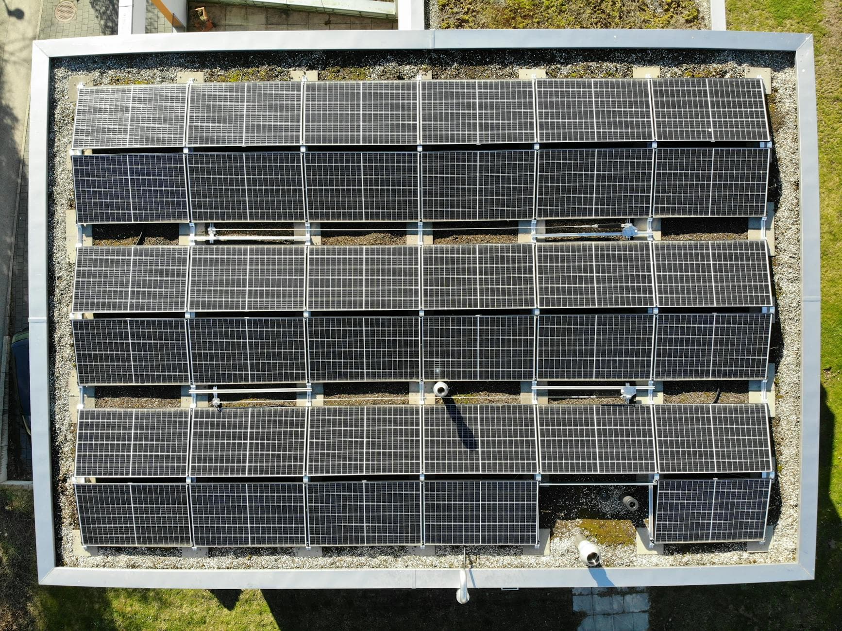 Aerial view of solar panels on a rooftop in Zurich, showcasing clean energy solutions.