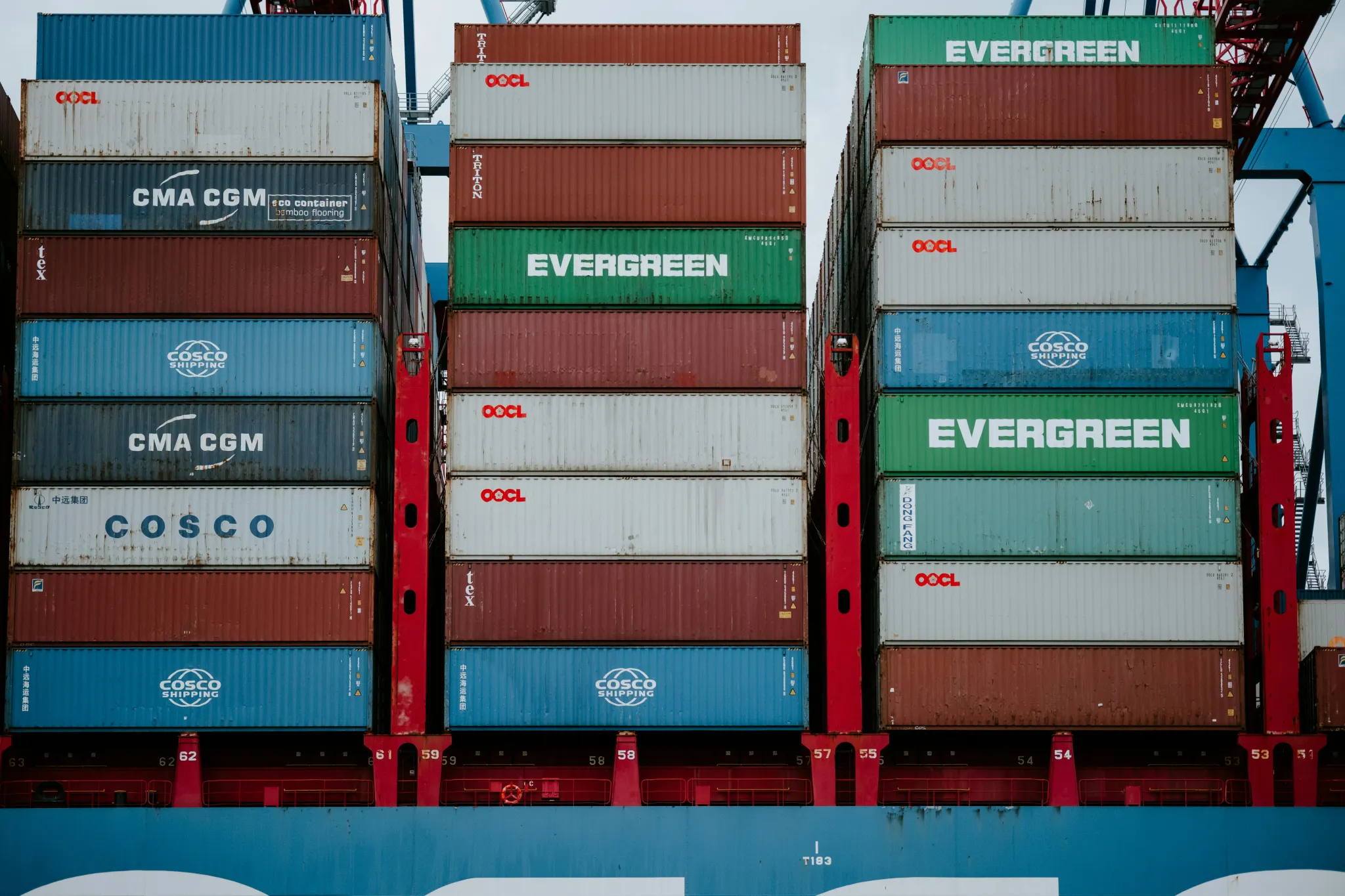 a stack of cargo containers sitting on top of a truck