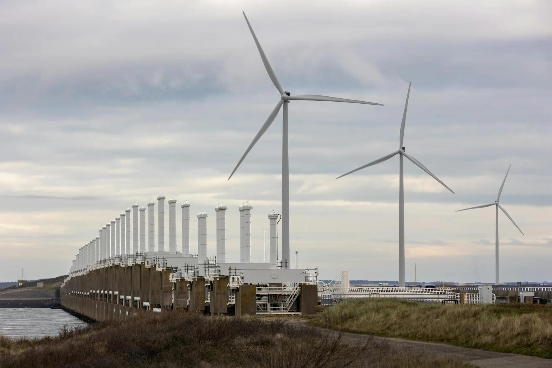 A view of wind turbines and Oosterscheldekering dam in Zeeland, Netherlands.