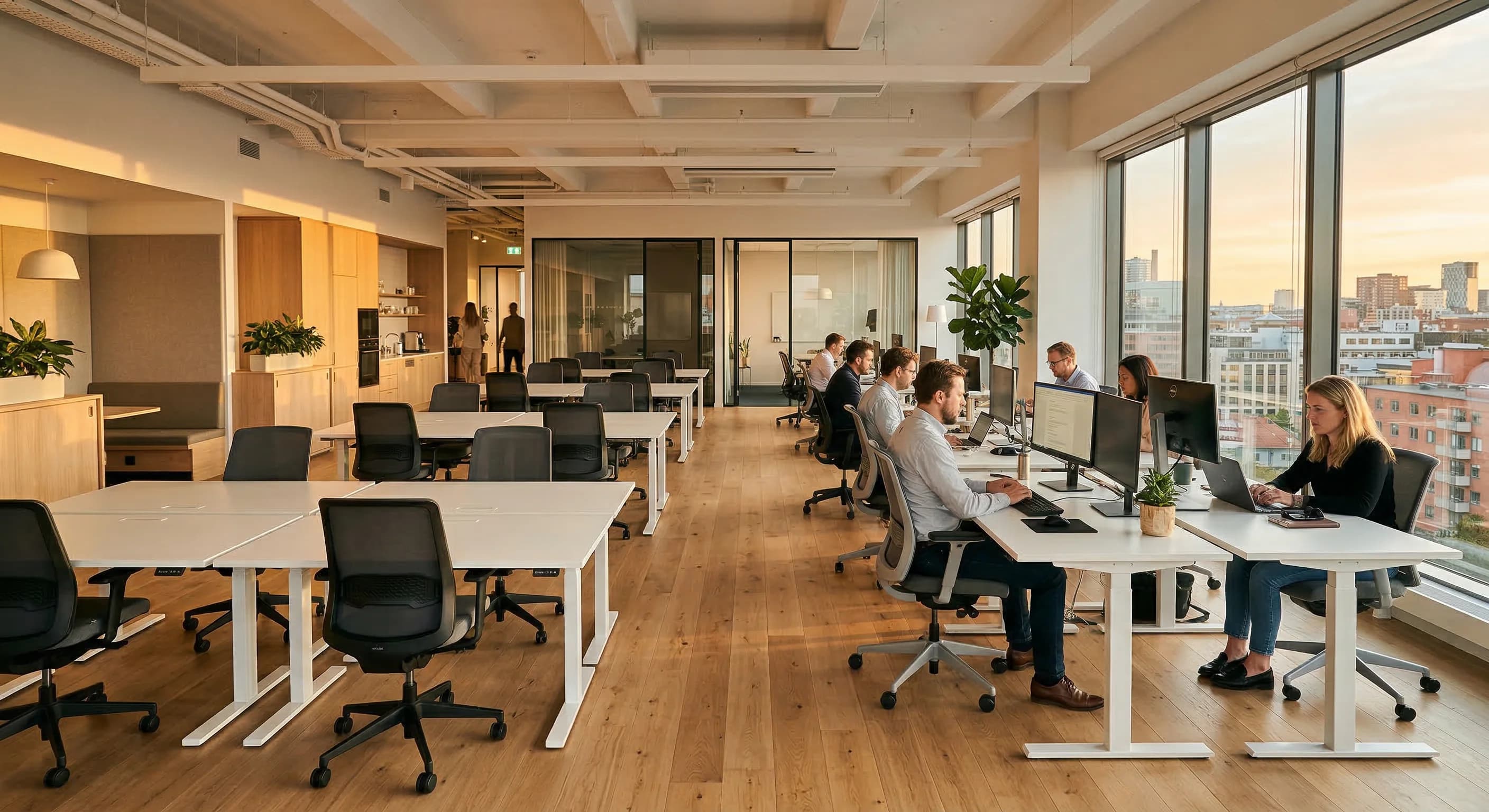 A photorealistic wide-angle shot of a modern Scandinavian-style office during the golden hour. The scene shows a series of clean white desks and ergonomic chairs, with some desks being used by profess