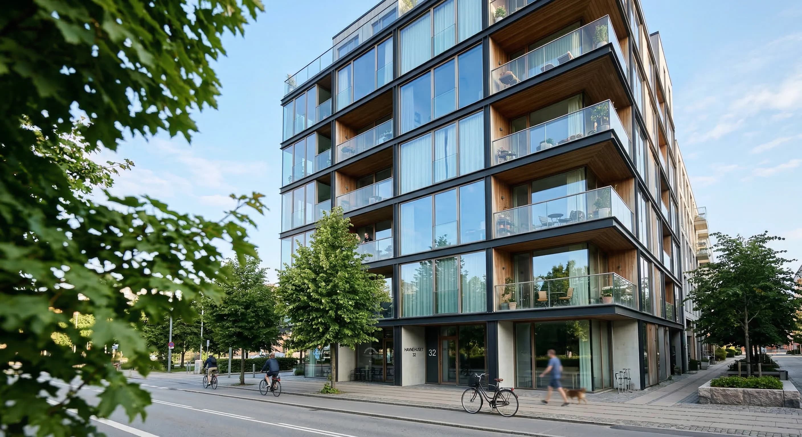 A low-angle photorealistic shot of a modern residential apartment building with large glass windows and balconies, typical of Northern European architecture. The scene is captured in soft, natural mor