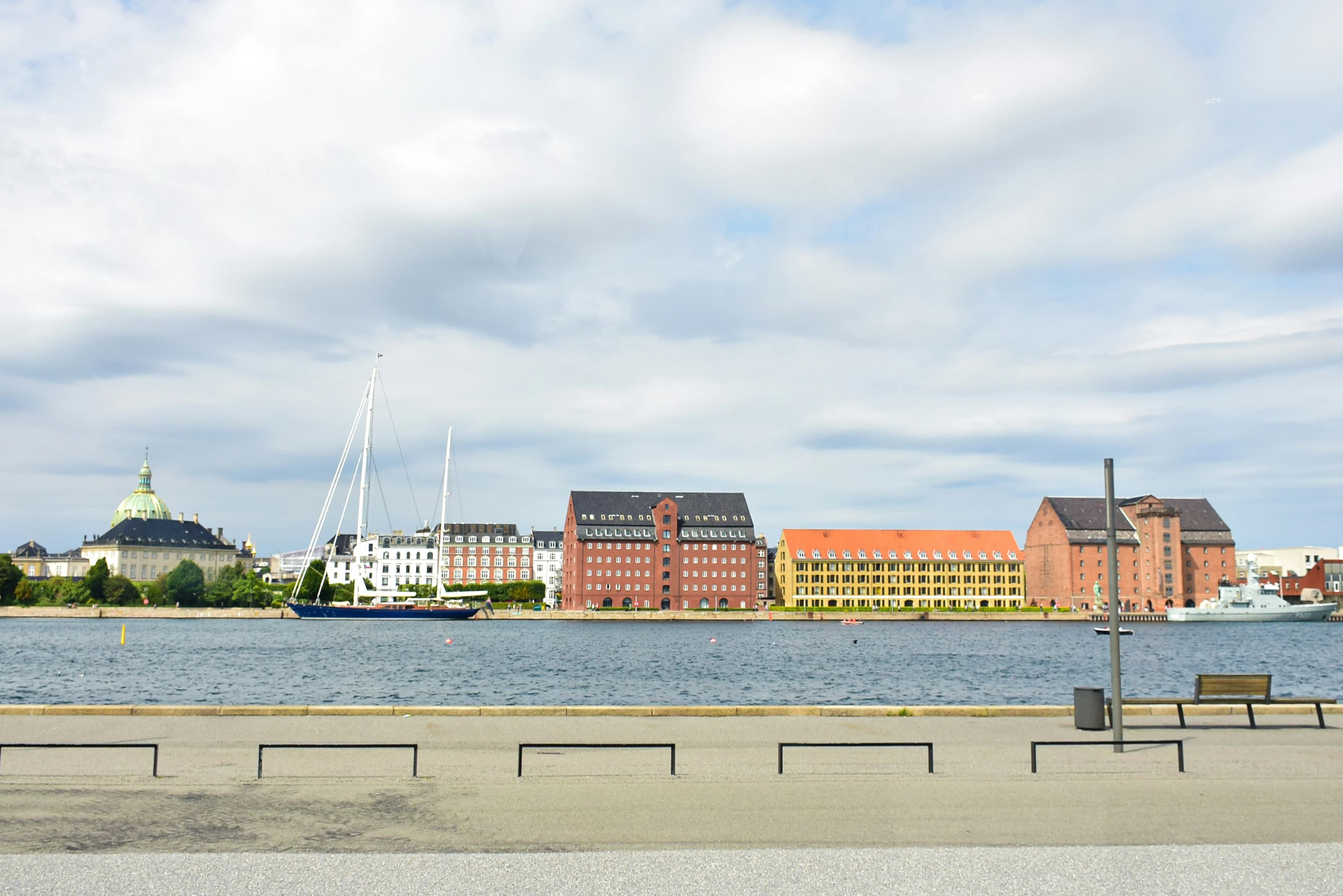 a body of water with a bunch of buildings in the background
