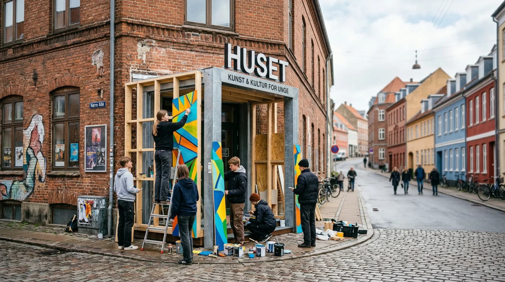 A photorealistic wide-angle shot of a creative youth culture center in a Northern European town during a bright overcast day. In the foreground, a weathered brick building features a new, modern entra
